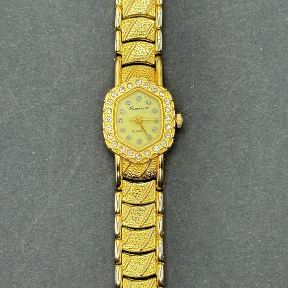 Ronica gold tone ladies watch with rhinestone accents. - Picture 2 of 5